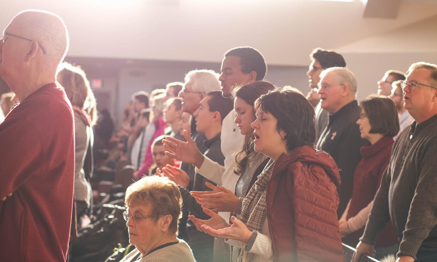 people in church worshipping